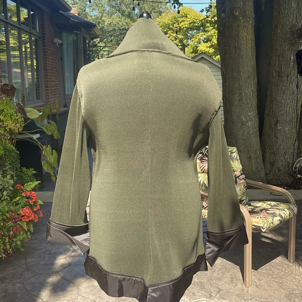 One of a kind Designer evening jacket. Very light weight with unique details.